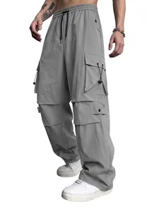Close-up detail of men's gray techwear cargo pants with multiple utility pockets