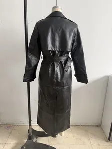 Detailed back view of women's long black faux leather trench coat with belted waist