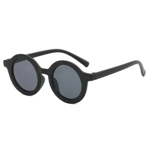 Macro detail view of vintage matte black round frame sunglasses for kids and toddlers
