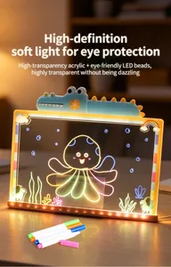 Glowing cartoon drawing board with octopus illustration and colorful marker pens