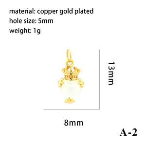 Detailed macro view of a copper gold-plated heart pendant with crown and dimensions