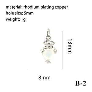 Detailed macro view of a rhodium-plated heart pendant with crown and size specifications