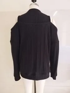 Detailed view of the black ribbed off-shoulder long sleeve knit top on a mannequin