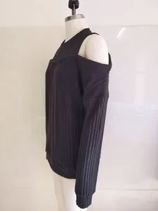 Detailed side view of black ribbed cold-shoulder long sleeve knit top on mannequin display