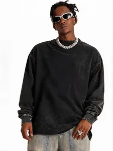 Detailed lifestyle view of a model wearing an oversized washed black vintage t-shirt