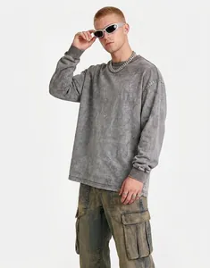 Full view of oversized washed grey long-sleeve T-shirt on model with streetwear styling.