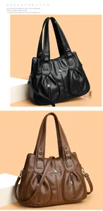 Elegant black and brown leather handbags for women featuring a kangaroo logo design.