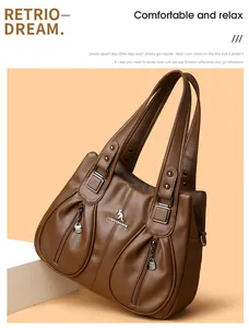 Close-up of brown textured leather shoulder bag with decorative kangaroo logo