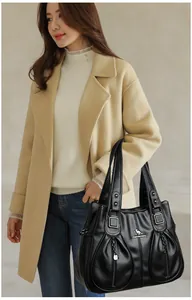 Elegant black faux leather handbag with large capacity and kangaroo logo for stylish women.
