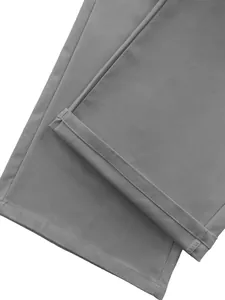 Close-up detail of grey functional parachute cargo pants showing durable hem stitching