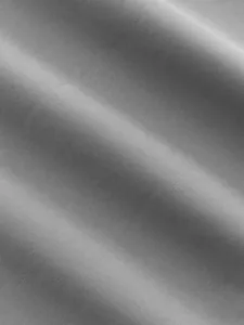 Close-up macro texture shot of the grey quick-dry functional fabric for cargo pants