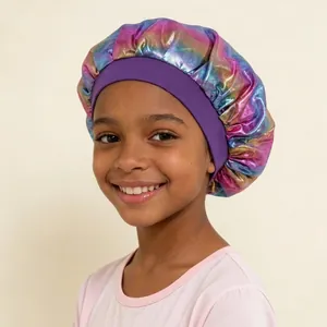 Detailed shot of a child wearing a colorful iridescent sleep bonnet with a purple band