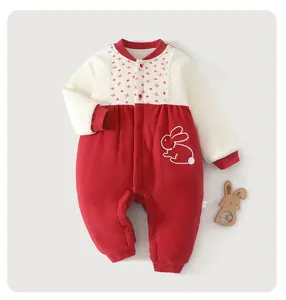 Macro detail of baby winter cotton-padded romper with cute bunny embroidery and lace