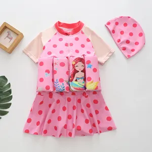 Pink polka dot girls buoyancy swimsuit with mermaid print and matching cap