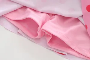 Close-up detail of the comfortable built-in safety shorts lining on pink girls' one-piece swimsuit