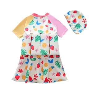 Children's buoyancy swimsuit set with colorful fruit print and matching swim cap