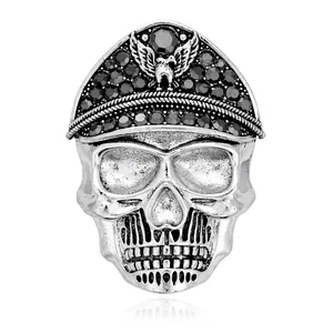 Gothic silver alloy skull brooch featuring black rhinestones and a detailed eagle emblem