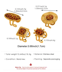 Detailed view of four stainless steel rings with leopard print and specific measurements