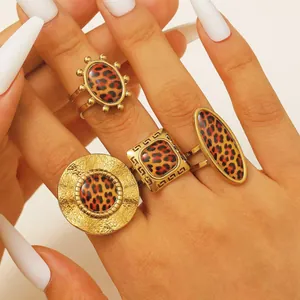 Fashionable gold-toned ring set featuring leopard print stones for elegant women's jewelry