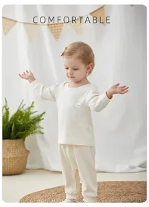 Soft toddler cream cotton thermal pajama set with cute bear print and ribbed cuffs