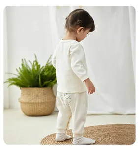 Comfortable toddler cream cotton thermal underwear set with cute bear print detail on pants