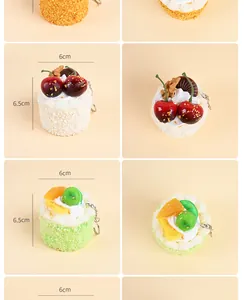 Realistic simulation mousse cake keychain with detailed fruit and cream toppings