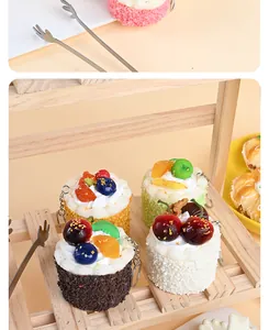 Detailed view of lifelike PU mousse cake keychains with realistic fruit and cream textures