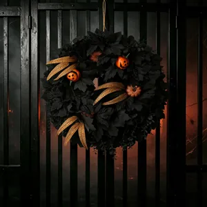 Spooky Halloween wreath with black maple leaves and mini pumpkins for front door hanging