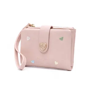 Pink bifold wallet for women with embroidered hearts and a heart buckle detail