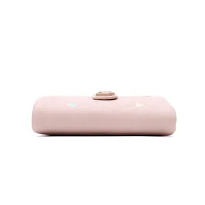 Side view of pink leather folding wallet with colorful heart embroidery details