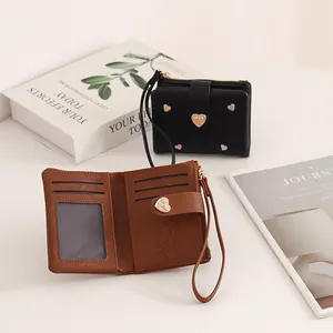 Detailed view of the brown leather wallet interior showing card slots and ID window.