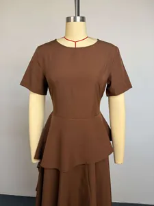Front view of a brown short-sleeved dress with high waist and asymmetric hem on mannequin