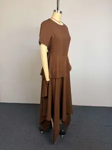 Detailed side view of a brown short-sleeved high-waisted dress with asymmetrical hem