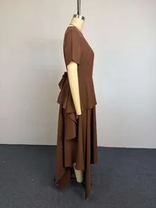 Side profile of a brown short-sleeved asymmetrical layered long dress on a mannequin