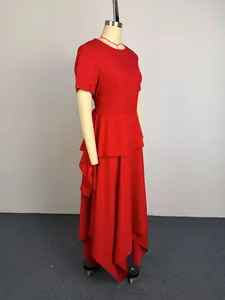 Side view of red short sleeve maxi dress with asymmetric ruffled hem on mannequin