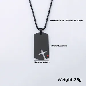 Detailed shot of black stainless steel dog tag necklace with hollow cross and red gem