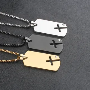 Detail view showing three stainless steel dog tag pendants with cross cut-outs.
