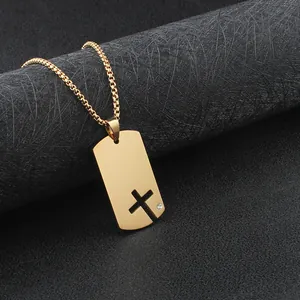 Men's polished gold stainless steel dog tag necklace featuring a hollowed-out cross with a small crystal