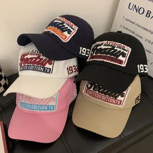 Vintage baseball caps with letter patches in multiple colors and soft top design