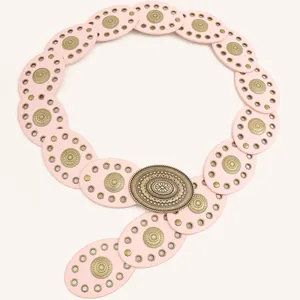 Close-up of pink Bohemian punk belt featuring a vintage-style intricate oval metal buckle