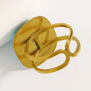 Back view of bohemian gold turquoise ring with adjustable hollow band details