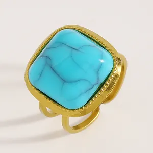 Detailed view of a bohemian turquoise ring featuring a vintage gold adjustable band