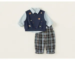 Boy's gentleman outfit set including light blue shirt, navy vest, and plaid trousers