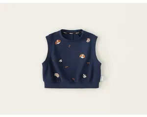 Detailed view of navy blue kids sleeveless vest with cute embroidered dog patterns