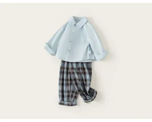 Smart casual toddler boy's set featuring a light blue shirt and blue plaid pants