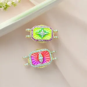 Detailed macro view of bohemian tarot style enamel pendants with sun and eye motifs