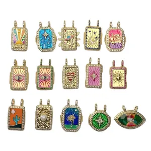 Set of bohemian style gold tarot card pendants with enamel motifs and colorful zircons