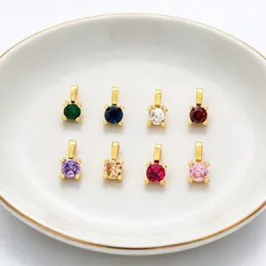Collection of colorful 18K gold-plated round cubic zirconia pendants for DIY jewelry making.