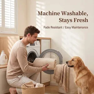 Beige waffle weave couch cover being placed in a washing machine for cleaning