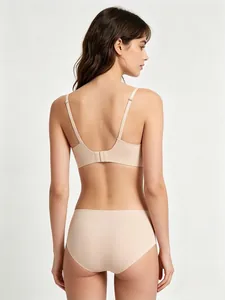 Back view of a seamless nude lingerie set featuring a wireless bra and matching panties
